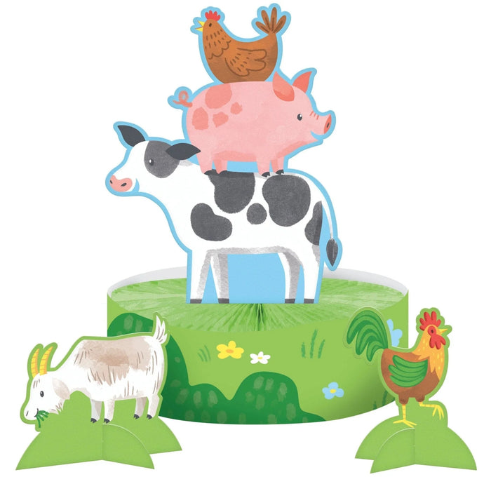 Colorful cardboard honeycomb centerpiece featuring stacked farm animals including a cow, pig, chicken, and goat on a green grass base with flowers.