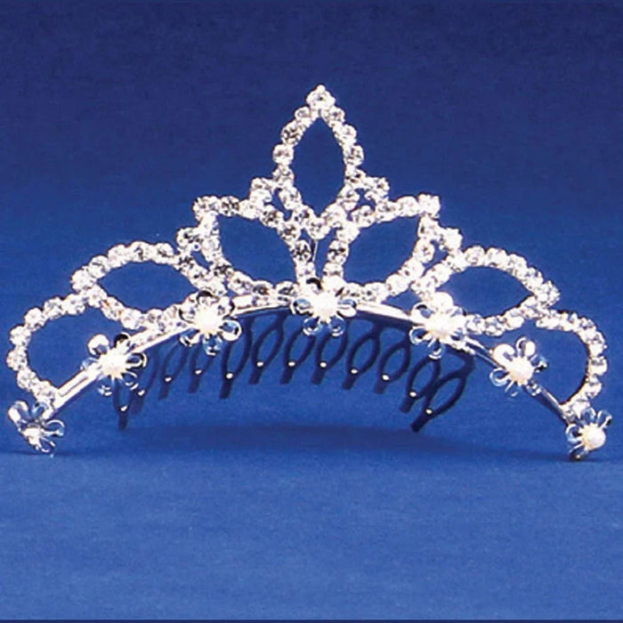 Silver-toned ornate tiara with filigree detailing, rhinestone embellishments, and dangling pearl accents along the comb base, displayed against a blue background.