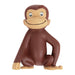 Figurine Candle of a smiling brown monkey with tan face and hands, sitting upright against a white background.