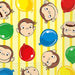 Yellow striped napkins with cartoon monkey faces and colorful balloons in red, blue, and green throughout the design.