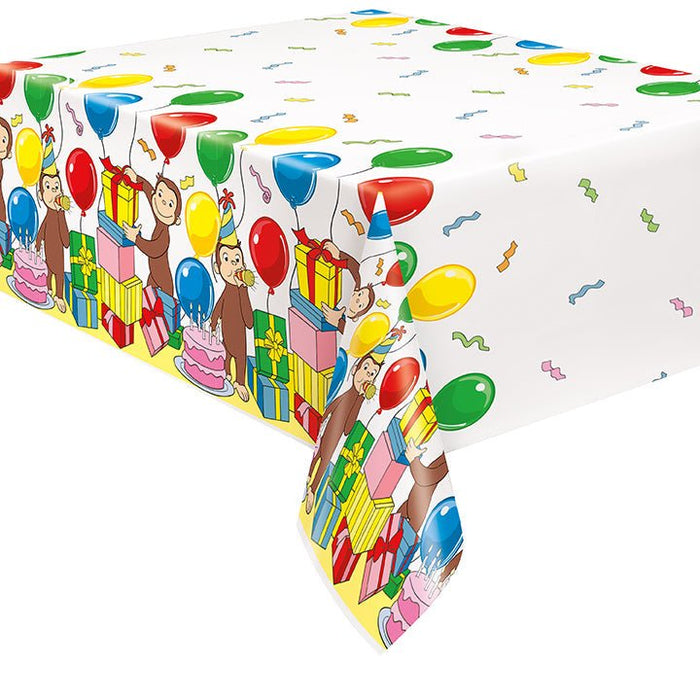 Plastic tablecover featuring Curious George the monkey with colorful balloons, wrapped gifts, and confetti on a white background.