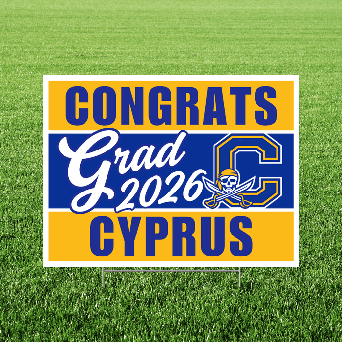 Yard sign with blue and gold horizontal stripes displaying "CONGRATS Grad 2026 CYPRUS" text with a pirate skull and crossbones logo in the center.