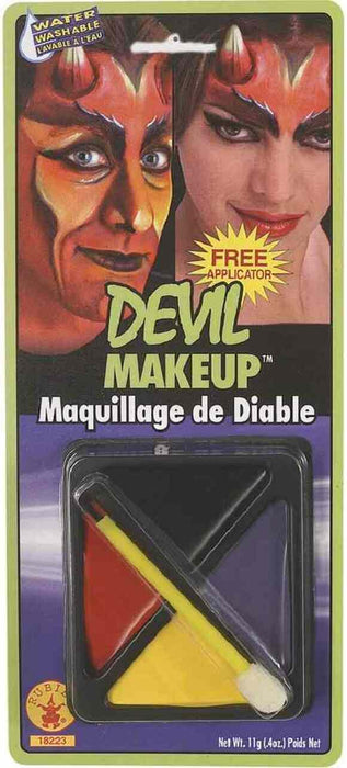 Water-washable devil makeup kit with red, yellow, and black face paint and applicator brush on green and purple packaging.