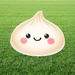 Large dumpling-shaped yard sign with a smiling face and pink cheeks, displayed on a lawn with an H stake stand.