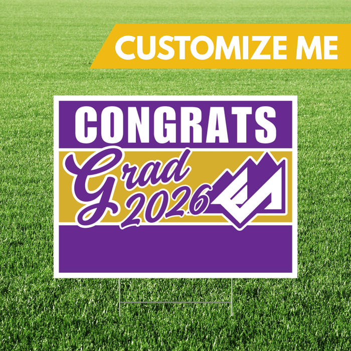 Graduation-themed sign with 'Congrats Grad 2026' on a grass background