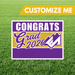 Graduation-themed sign with 'Congrats Grad 2026' on a grass background