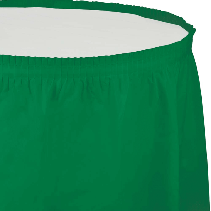 Emerald green plastic tableskirt with vertical pleats and an elastic top edge, displayed laid out to show its full length and gathered waistband.
