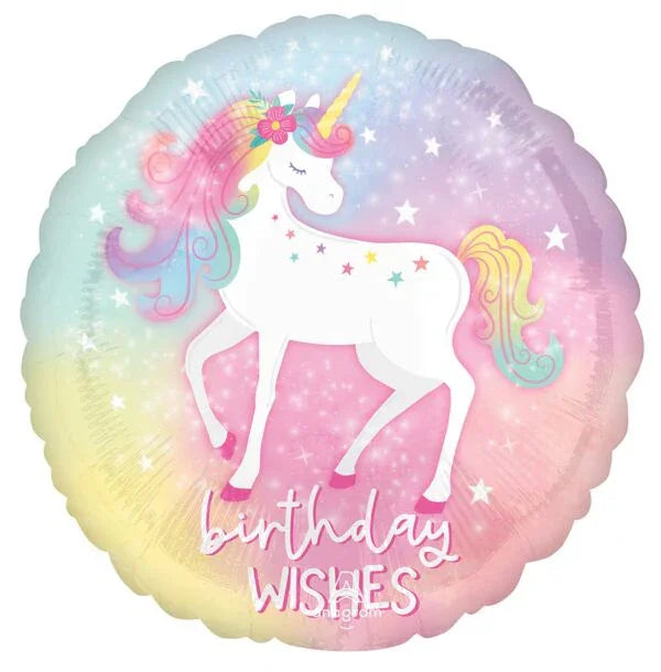 Round pastel rainbow mylar balloon featuring a white unicorn with pink and gold mane, flower crown, and "Birthday Wishes" text surrounded by colorful stars.