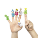Two hands display six colorful finger puppets including a green dragon, blue wizard, king in purple, knight in gray armor, crowned frog, and white unicorn, representing a fairy tale character set.