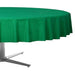 Green oval tablecloth draped over a silver metal table base, showing the fabric's gathered folds and drape.