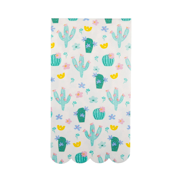 White dinner napkins featuring a repeating pattern of turquoise cacti, green potted succulents, and colorful flowers in pink, purple, and yellow with scalloped bottom edges.