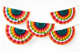Five rainbow-striped paper fan decorations with teal pleated centers arranged in a garland string against a white background.