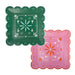 Two decorative scalloped square paper plates in green and pink with floral motifs, small flowers, and geometric patterns throughout the design.