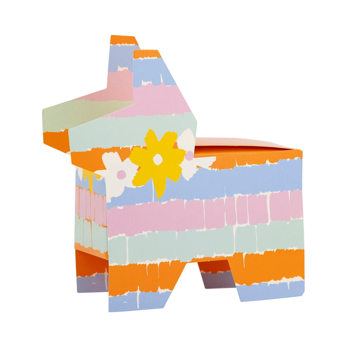 Colorful cardboard treat box with horizontal stripes in orange, blue, pink, green, and cream, decorated with a yellow flower and white daisy, designed for party favors or celebrations.