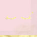 Pink lunch napkins with yellow foil crescent moon designs and decorative borders arranged on a coordinating background.
