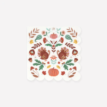Square napkin featuring a symmetrical folk art design with autumn pumpkins, fall leaves, flowers, and decorative botanical elements in orange, brown, green, and cream tones.