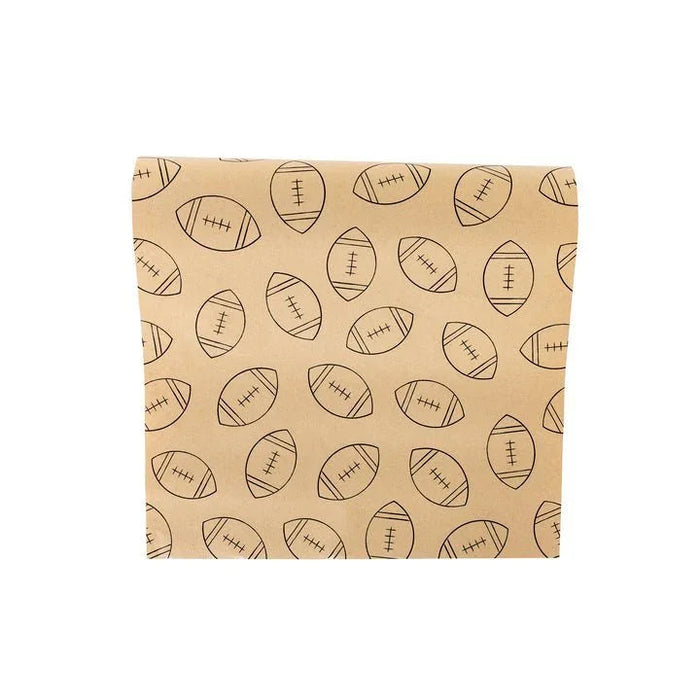 Tan kraft paper table runner with an all-over pattern of brown outlined footballs in various rotations.