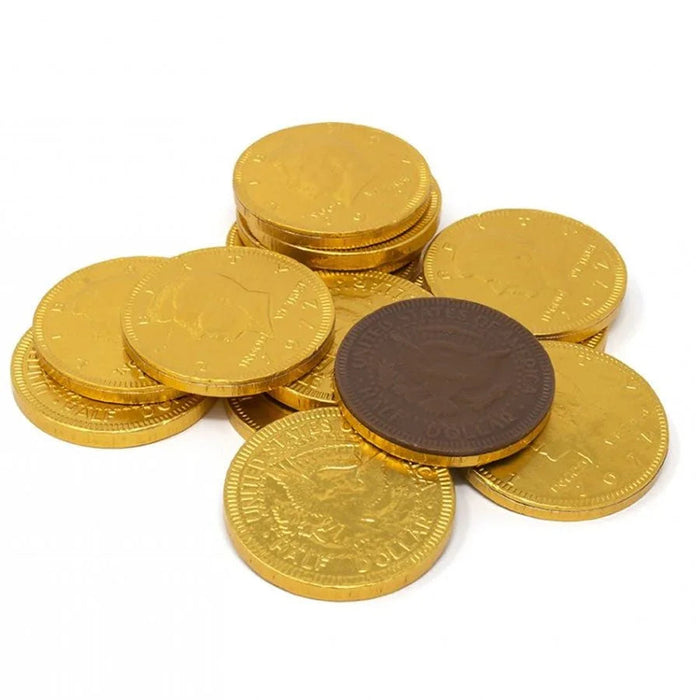 Stack of gold foil-wrapped chocolate coins with one dark brown coin in the center, arranged in a loose pile against a white background.