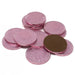 A pile of foil-wrapped chocolate coins in pink and brown, with embossed details visible on the metallic wrappers.