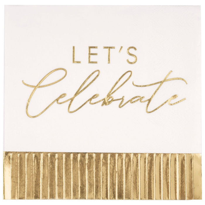 White lunch napkins with gold foil lettering reading "Let's Celebrate" and a gold pleated fringe border along the bottom edge.