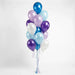 Bouquet of 13 metallic and pearl balloons in blue, purple, light blue, and white with matching ribbons and curled string ties against a white background.