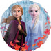 Round foil balloon featuring two animated sisters in winter clothing against a snowy blue background with falling autumn leaves in red and orange tones.