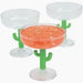 Four clear plastic margarita glasses with bright green cactus-shaped stems holding a coral-colored frozen drink garnished with salt rim.