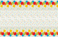 Festive plastic tablecover with colorful balloons in red, blue, yellow, green, and orange arranged along the top and bottom borders, with multicolored confetti dots scattered across a white background.