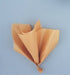 Five sheets of gold metallic tissue paper folded into a decorative bundle against a light blue background.