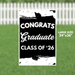 Black and white yard sign reading "CONGRATS Graduate CLASS OF '26" with graduation cap decorations, measuring 24 inches by 36 inches.