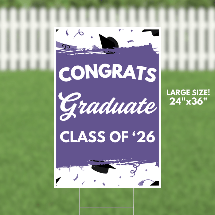 Purple and white yard sign reading "Congrats Graduate Class of '26" with black graduation cap decorations and confetti motifs throughout the design.