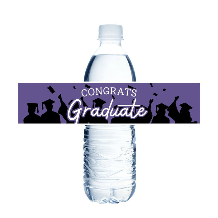 Purple water bottle label wrap featuring "CONGRATS Graduate" text in white with silhouettes of graduates throwing caps, designed to fit standard water bottles.