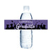 Purple water bottle label wrap featuring "CONGRATS Graduate" text in white with silhouettes of graduates throwing caps, designed to fit standard water bottles.