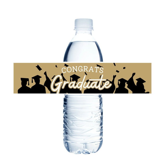 Water bottle with a gold and black "Congrats Graduate" label wrapped around the center, featuring silhouettes of graduates in caps and gowns.