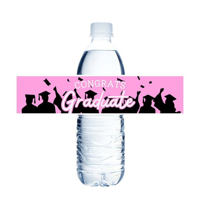 Pink water bottle label with black silhouettes of graduating students and white "CONGRATS Graduate" text, designed to wrap around a clear plastic water bottle.