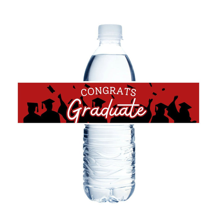 Clear plastic water bottle with a red label band featuring black silhouettes of graduates in caps and gowns with white "CONGRATS Graduate" text.