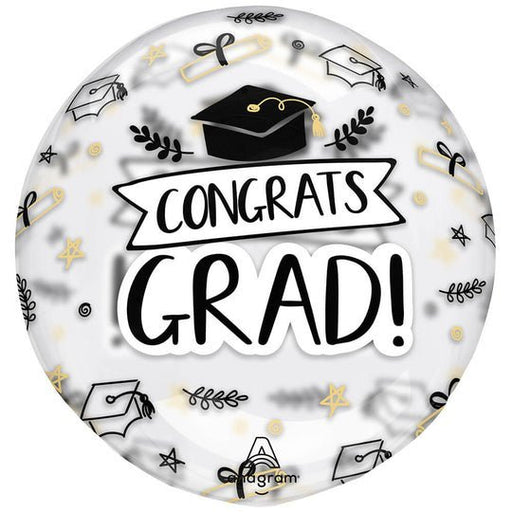 Round clear mylar balloon with "Congrats Grad" text in black, featuring graduation caps, stars, and gold accents throughout the design.