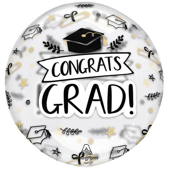 Round clear mylar balloon with "Congrats Grad" text in black, featuring graduation caps, stars, and gold accents throughout the design.