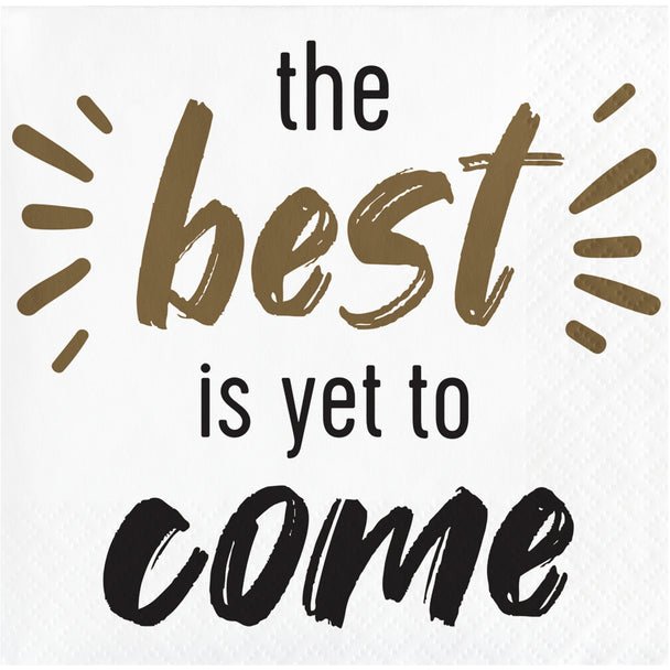 White napkin with tan and black text reading "the best is yet to come" with decorative radiating lines around the word "best".