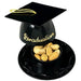 Black graduation cap decoration with gold tassel and "Graduations" text contains a small black bowl filled with peanuts.