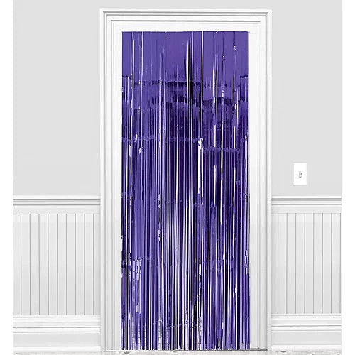 Purple metallic fringe curtain with vertical strands hanging from a blue-purple header, displayed against a white wall with wainscoting.