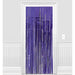 Purple metallic fringe curtain with vertical strands hanging from a blue-purple header, displayed against a white wall with wainscoting.