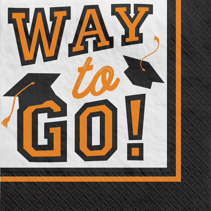 Black and white beverage napkin with large orange text reading "WAY to GO" and two black graduation caps with orange tassels in the corners.