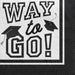 White beverage napkin with black text reading "Way to Go" and two black graduation caps with tassels in the corners.