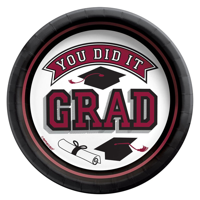 Round paper plate with maroon and black border featuring "You Did It Grad" text, graduation cap and diploma illustrations on white center.