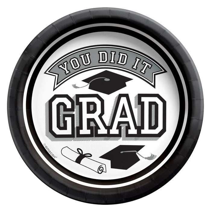 Round white paper plates with a black rim featuring "You Did It Grad" text, graduation caps, and a diploma illustration in the center.
