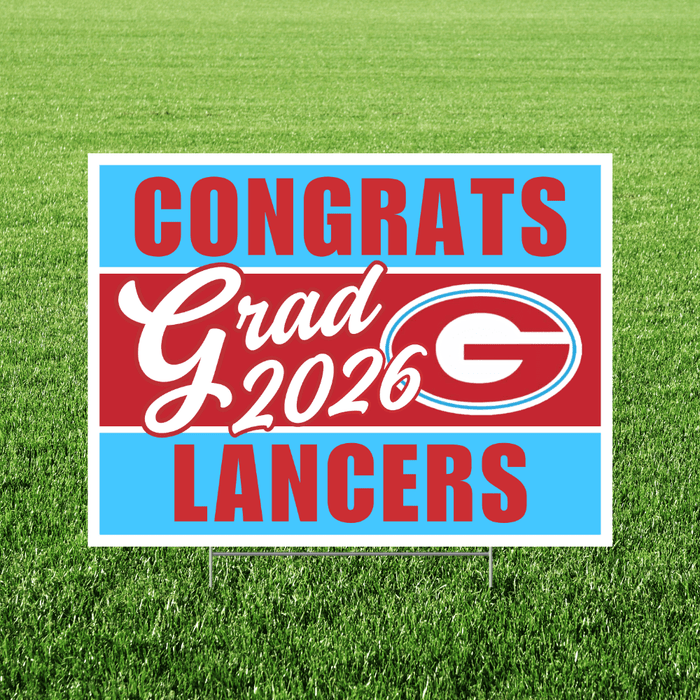 Yard sign with blue and red horizontal stripes reading "Congrats Grad 2026 Langers" with a large "G" logo in the center, displayed on grass.