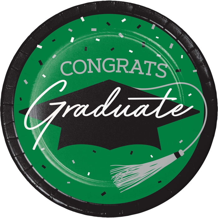 Round green paper plate with black rim featuring "CONGRATS Graduate" text, a black mortarboard cap, white confetti, and a paintbrush design.