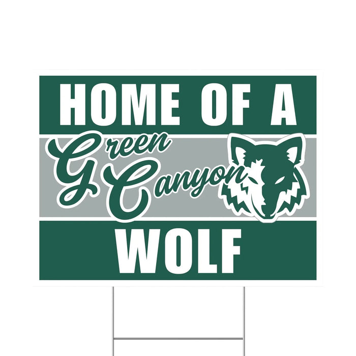 Green and white rectangular yard sign reading "Home of a Green Canyon Wolf" with a wolf head graphic in the center.