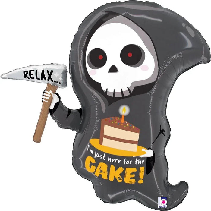 Grim reaper-shaped foil balloon with skull face, red eyes, black hood, holding a scythe labeled "RELAX," displaying a birthday cake and text reading "I'm just here for the CAKE.